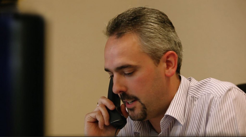 Jason on phone CRM Marketing