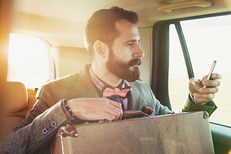 Bearded man in taxi small-min Cloud accounting ERP